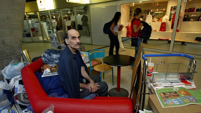 In this file photo, Merhan Karimi Nasseri sits among his belongings at Terminal 1 of Roissy Charles De Gaulle Airport, north of Paris in 2004 . Photo / AP
