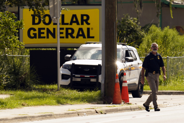 Law enforcement officials continue their investigation at a Dollar General Store that was the scene of a mass shooting, Sunday, Aug. 27, 2023, in Jacksonville, Fla. Photo / AP