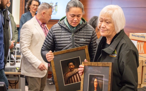 Whānau carry images of their tūpuna into the High Court during a 2023 hearing on the Nelson Tenths land case. Photo: Supplied / RNZ