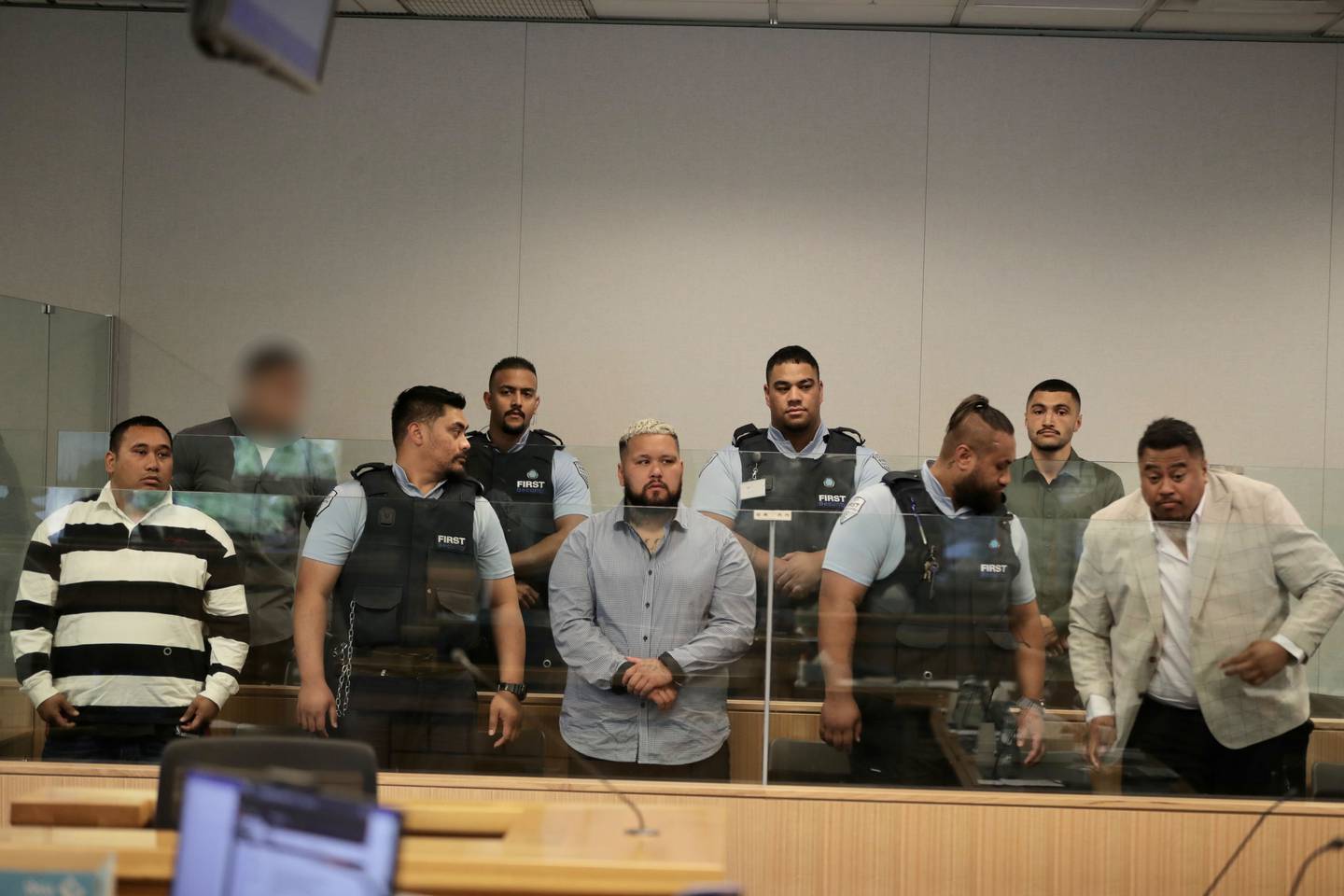 Five Head Hunters motorcycle gang members and associates are on trial in the High Court at Auckland. They are, left to right on the bottom row, Paraire Paikea, Marcus Nielsen and Fred Tanuvasa. On the top row is a man with name suppression and Tyran Panapa. Photo / Michael Craig