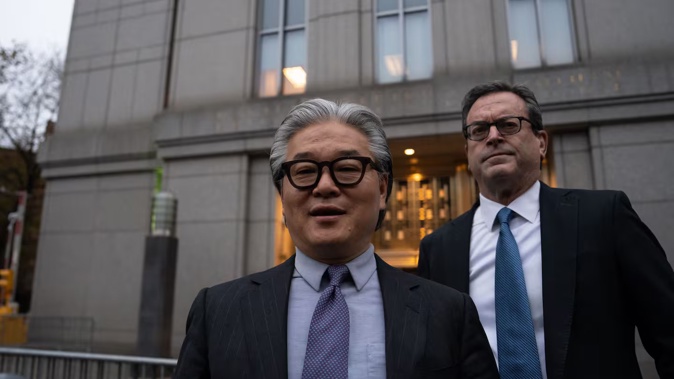 Sung Kook "Bill" Hwang (left), founder of Archegos Capital Management, leaves a federal court after his sentencing hearing for convictions of fraud and market manipulation, in New York City on November 20. Photo / Adam Gray, AFP