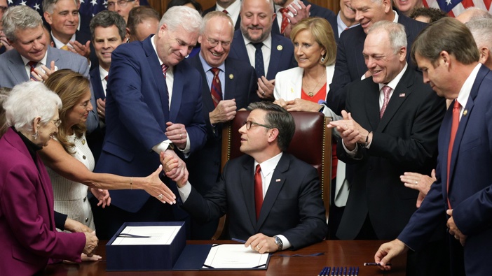 U.S. Speaker of the House Rep. Mike Johnson (R-LA) celebrates with fellow House Republicans during an enrollment ceremony of H.R. 1, the One, Big, Beautiful Bill Act at the U.S. Capitol on July 3, 2025 in Washington, DC. (Photo by Alex Wong/Getty Images)