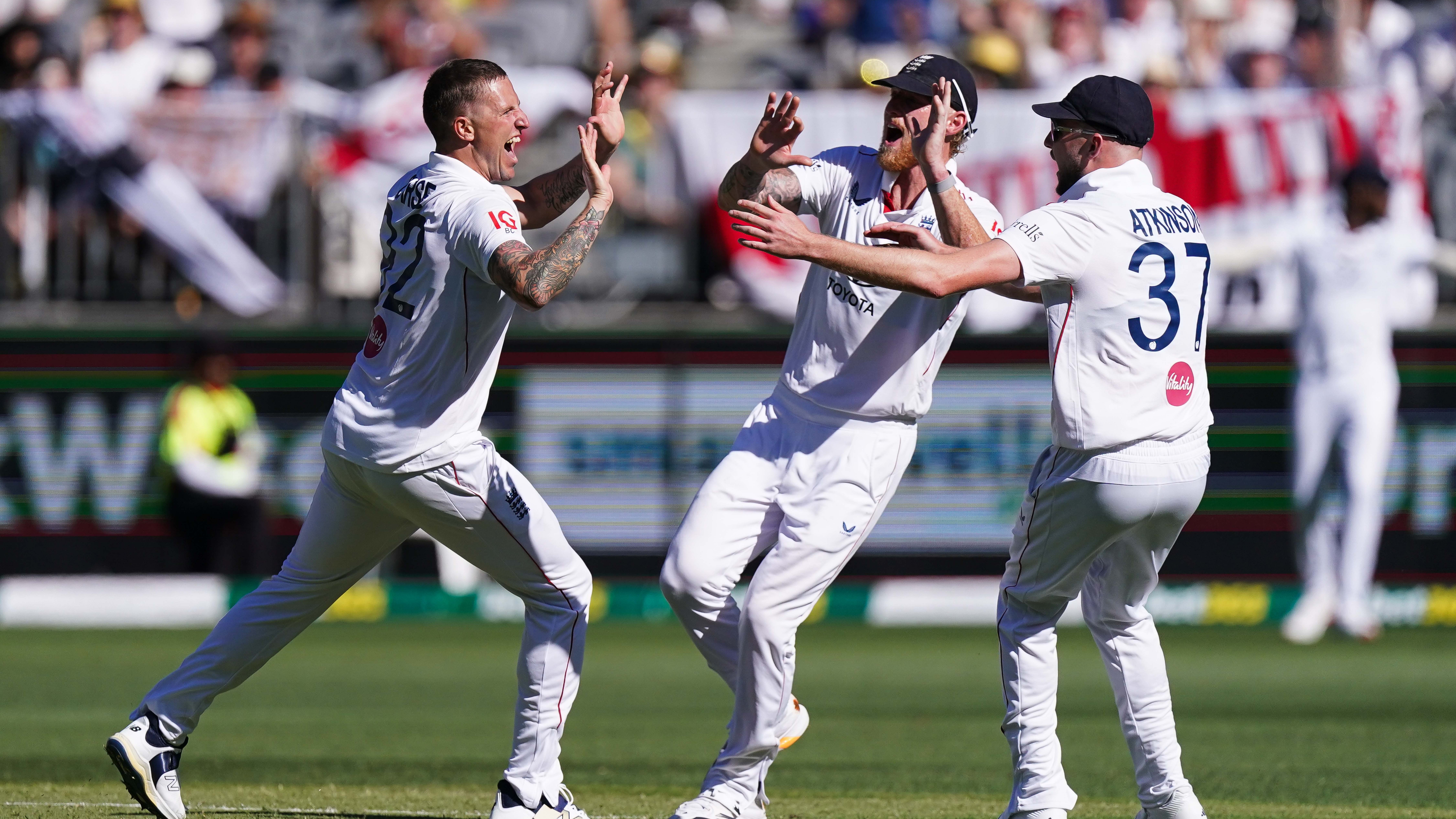 England's Brydon Carse (left) celebrates with teammates after taking the wicket of Australia's Usman Khwaja (not pictured) on day one of the first test of the NRMA Insurance Ashes Series 2025 at the Optus Stadium in Perth, Australia. (Photo by Robbie Stephenson/PA Images via Getty Images)