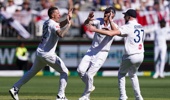 England's Brydon Carse (left) celebrates with teammates after taking the wicket of Australia's Usman Khwaja (not pictured) on day one of the first test of the NRMA Insurance Ashes Series 2025 at the Optus Stadium in Perth, Australia. (Photo by Robbie Stephenson/PA Images via Getty Images)