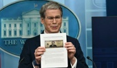 US Secretary of Treasury Scott Bessent shows a proposed $250 bill featuring President Donald Trump during a press briefing in the Brady Briefing Room of the White House in Washington, DC. Kent Nishimura / AFP