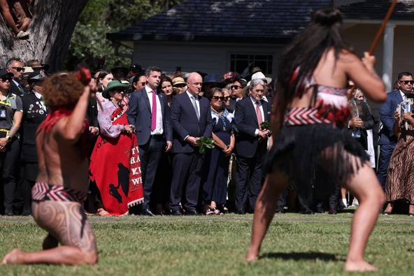Prime Minister Christopher Luxon, flanked by Act leader David Seymour (left) and New Zealand First leader Winston Peters (right), being welcomed on to the Waitangi Treaty Grounds in 2024. Photo / Getty Images