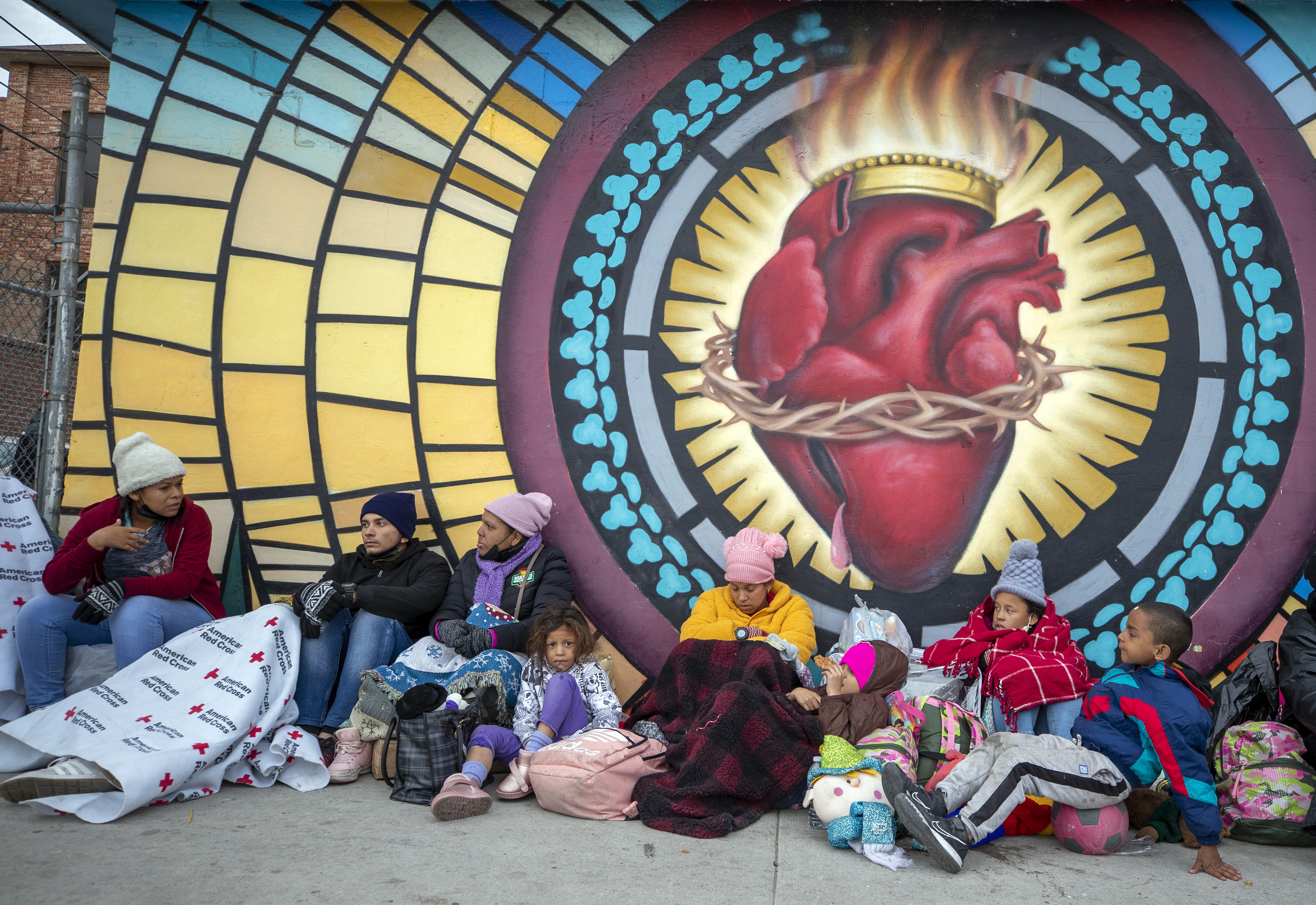 Migrants try to stay warm while camping outside the Sacred Heart Church in El Paso, Texas, on Sunday, Dec. 18, 2022. Growing numbers of migrants suffer violence that amounts to torture on their journeys. Doctors, social workers, clergy and shelter directors say they’re arriving at the US-Mexican border in desperate need for trauma-informed medical and mental health treatment. Photo / AP