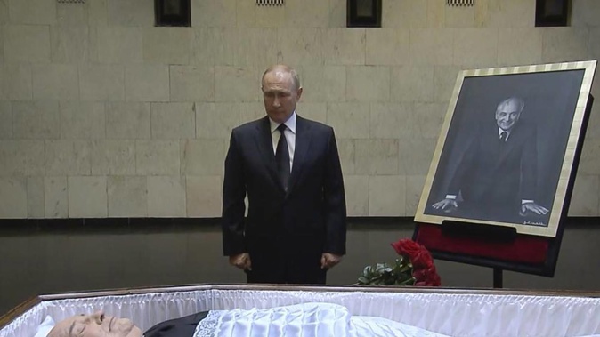 Russian President Vladimir Putin pays his last respect near the coffin of former Soviet President Mikhail Gorbachev at the Central Clinical Hospital in Moscow. Photo / Russian Pool via AP