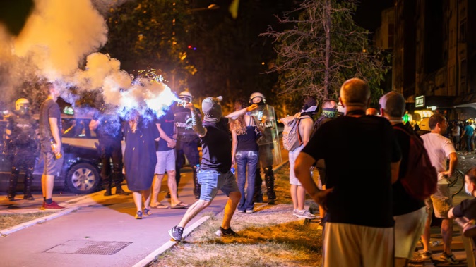 A conflict between protesters and supporters of the ruling Serbian Progressive Party escalates into clashes with police near the party's offices on Liberation Boulevard in Novi Sad, Serbia. Photo / Getty Images
