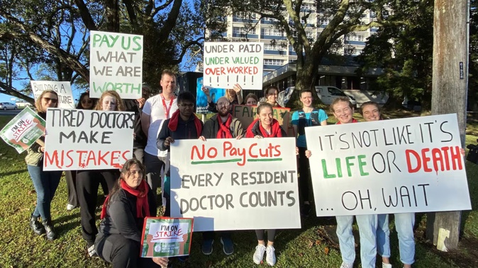 Junior doctors with the New Zealand Resident Doctors Association, pictured with signs outside Whangārei Hospital, say their pay is a matter of life and death. Photo / Denise Piper