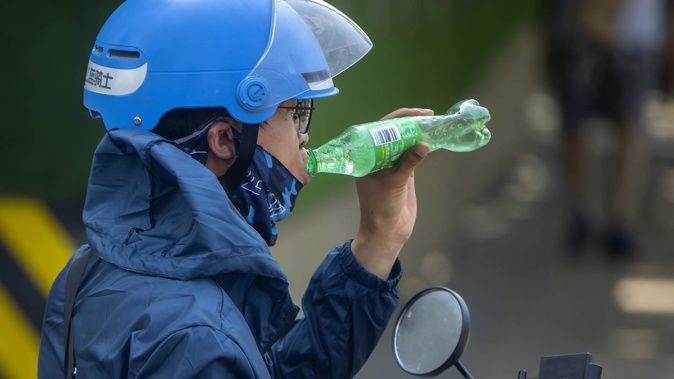 Authorities continued a rare red alert for high temperatures in parts of China's capital on Saturday, the highest level of warning, as highs were once again expected to climb to around 40 degrees Celsius. Photo / AP