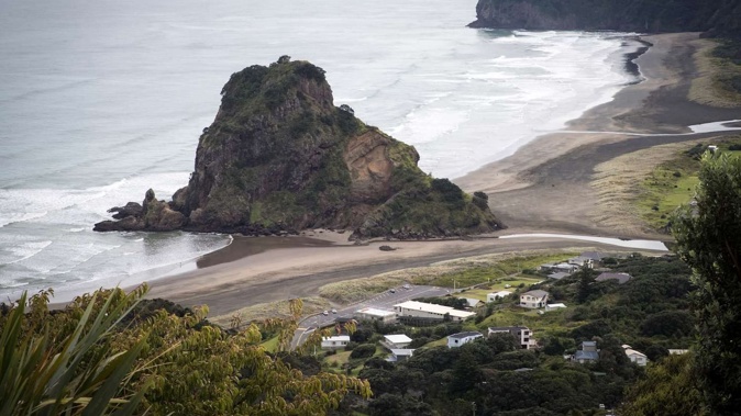 A fisherman is missing after falling into the water at Piha Beach, West Auckland, this afternoon. Photo / Jason Oxenham