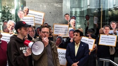 Local business owners and workers demonstrate outside the Auckland Council offices on Albert St. (Photo / Bernard Orsman)