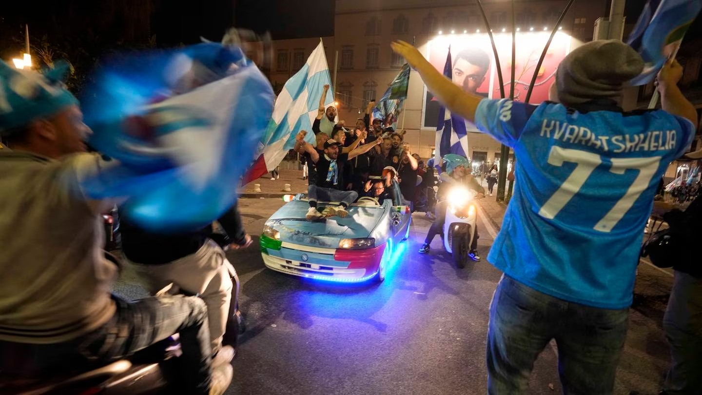 Napoli fans celebrate after winning the Italian league title, in Naples. Photo / AP