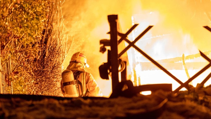 Firefighters rescued a person from a balcony at the home on Queenstown's Wynyard Crescent.