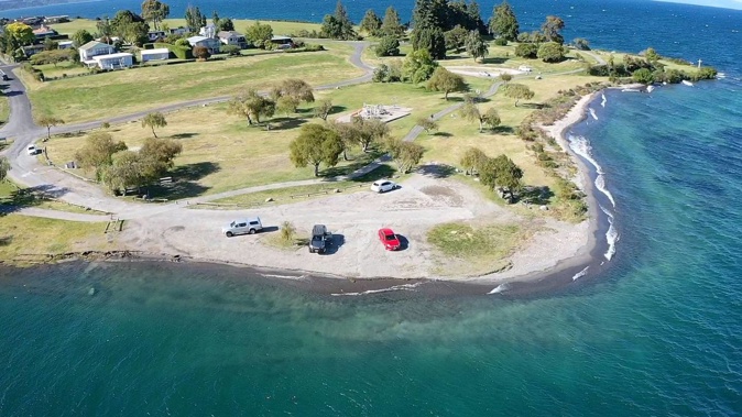 The Taupō District Council is urging people to stay away from the unstable water's edge at Four Mile Bay, Wharewaka over concerns more of it could fall into the lake. Photo / Supplied