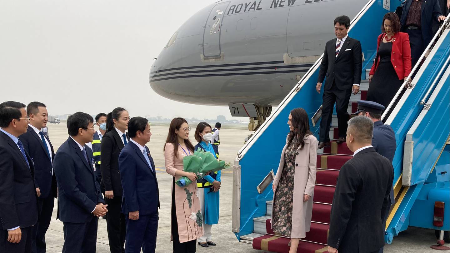 Prime Minister Jacinda Ardern arriving in Hanoi to be met by Viet Nam's Minister for Agriculture Lê Minh Hoan (centre) at the beginning of her three-day trip in Vietnam. Photo / Pool