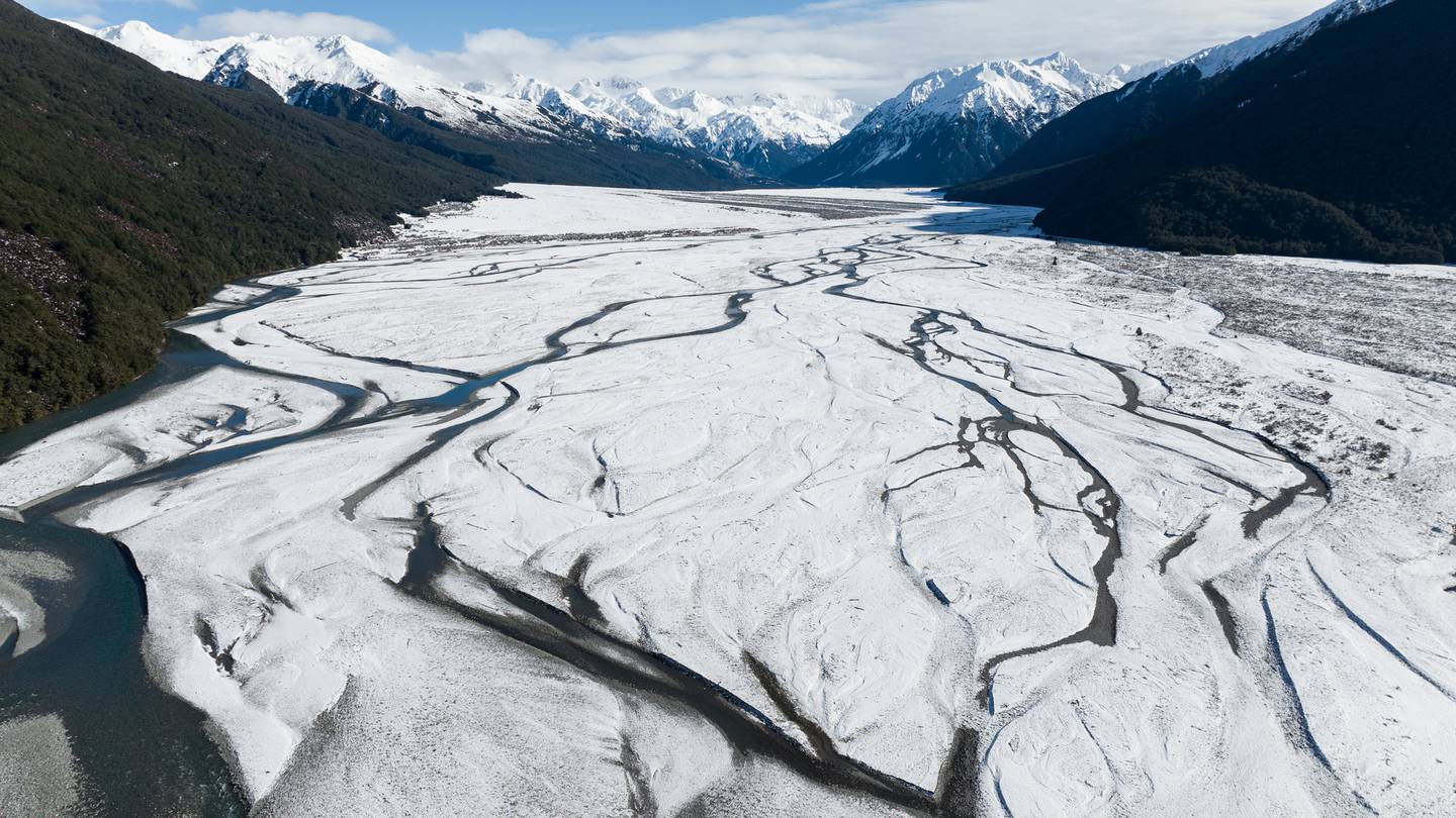 The storm has finally cleared through Arthurs Pass leaving a fresh dusting of snow on the Waimakariri River. (Photo / George Heard)