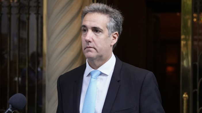 Michael Cohen leaves his apartment building on his way to Manhattan criminal court in New York, Tuesday, May 14, 2024. (AP Photo/Seth Wenig)