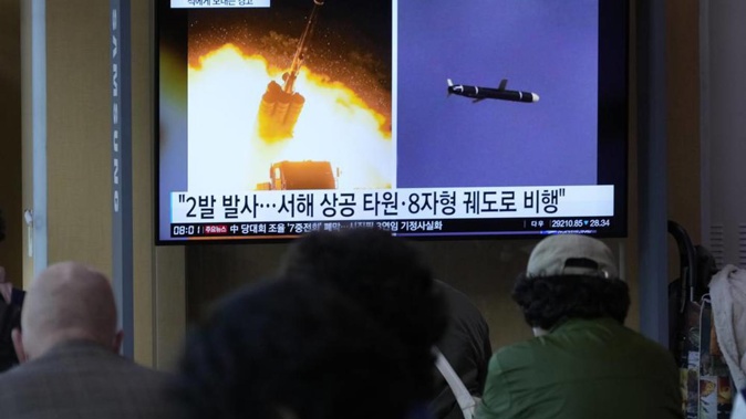 A TV screen shows file images of North Korea's missile launch during a news program at the Seoul Railway Station in Seoul. Photo / AP