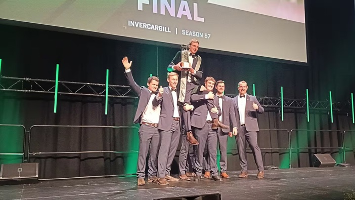 Hugh Jackson, the 2025 FMG Young Farmer of the Year, is held aloft by his fellow finalists at the Grand Final on Saturday night. Photo / Michelle Watt