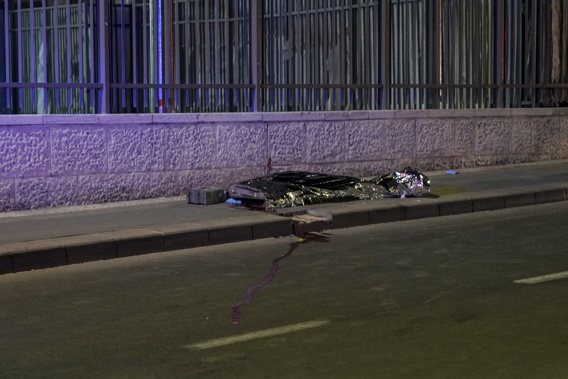 A body is covered on the side walks after a shooting attack near a synagogue in Jerusalem, Friday, Jan. 27, 2023. A Palestinian gunman opened fire outside an east Jerusalem synagogue Friday night, killing five people and wounding five others in one of the deadliest attacks on Israelis in years, medical officials said. The attack was halted when the gunman was shot by police. Photo / AP