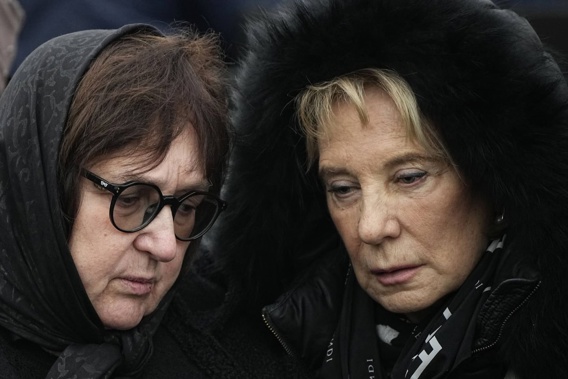 Russian opposition leader Alexei Navalny's mother, Lyudmila Navalnaya, left, and his mother-in-law pay their last respects to him at the Borisovskoye Cemetery, in Moscow. Photo / AP