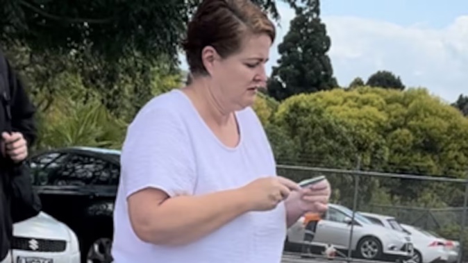 Elizabeth Audrey Donohue, known as Liz, arrives at the Pukekohe District Court with family this afternoon for sentencing on charges relating to the theft of $522k from her former employer. Photo / Belinda Feek