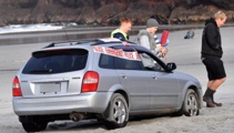 Stolen car found at beach 'dead as a doorknob'