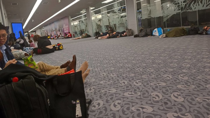 Flight QF163 was diverted to Auckland Airport and passengers were forced to sleep on the floor. Photo / Supplied