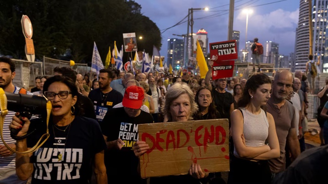 Thousands protested in Tel Aviv, demanding the Israeli Government end the Gaza war and secure hostages' return. Photo / Getty Images