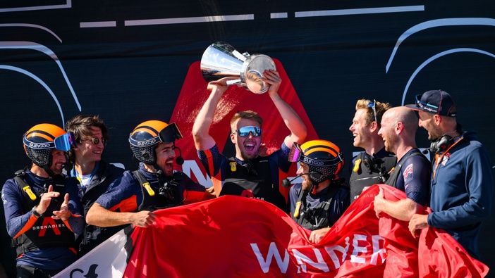 The AC75 Ineos Britannia team celebrate with the Louis Vuitton Cup after defeating The AC75 Luna Rossa Prada Pirelli Team during the race 11 of the Louis Vuitton Cup Final - 37th America's Cup on October 04, 2024 in Barcelona, Spain. (Photo by David Ramos/Getty Images)