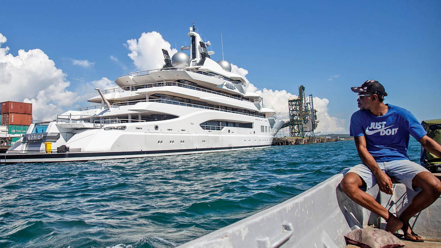 Boat captain Emosi Dawai looks at the superyacht Amadea docked at the Queens Wharf in Lautoka, Fiji, on April 13. On May 5, five US federal agents boarded the vessel. Photo / AP