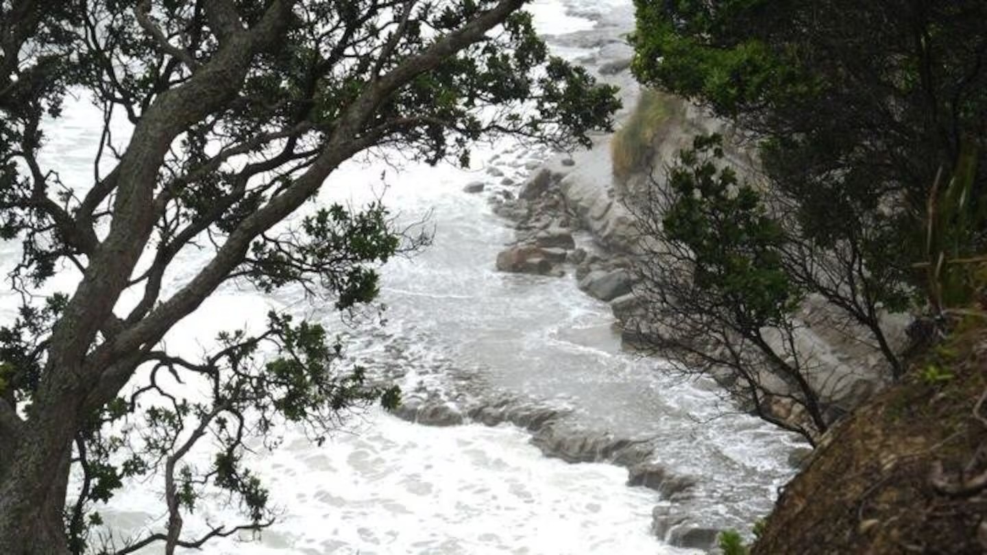 Body found on rocks at Long Bay Beach referred to coroner