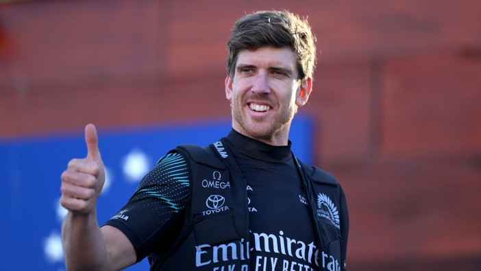Peter Burling, Captain of Emirates Team New Zealand acknowledges the fans after the race between Emirates Team New Zealand and Team Ineos Britannia in the 37th America's Cup on October 19, 2024 in Barcelona, Spain. (Photo by David Ramos/Getty Images)
