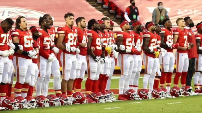 Kansas City Chiefs players link arms prior to their NFL match against the Houston Texans. Photo / Supplied