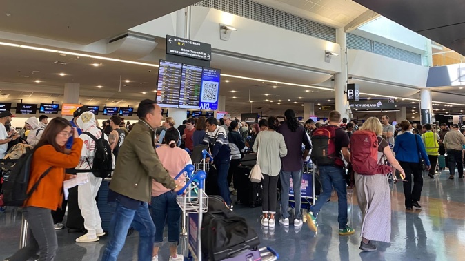 A technical issue at Auckland Airport is causing long delays.