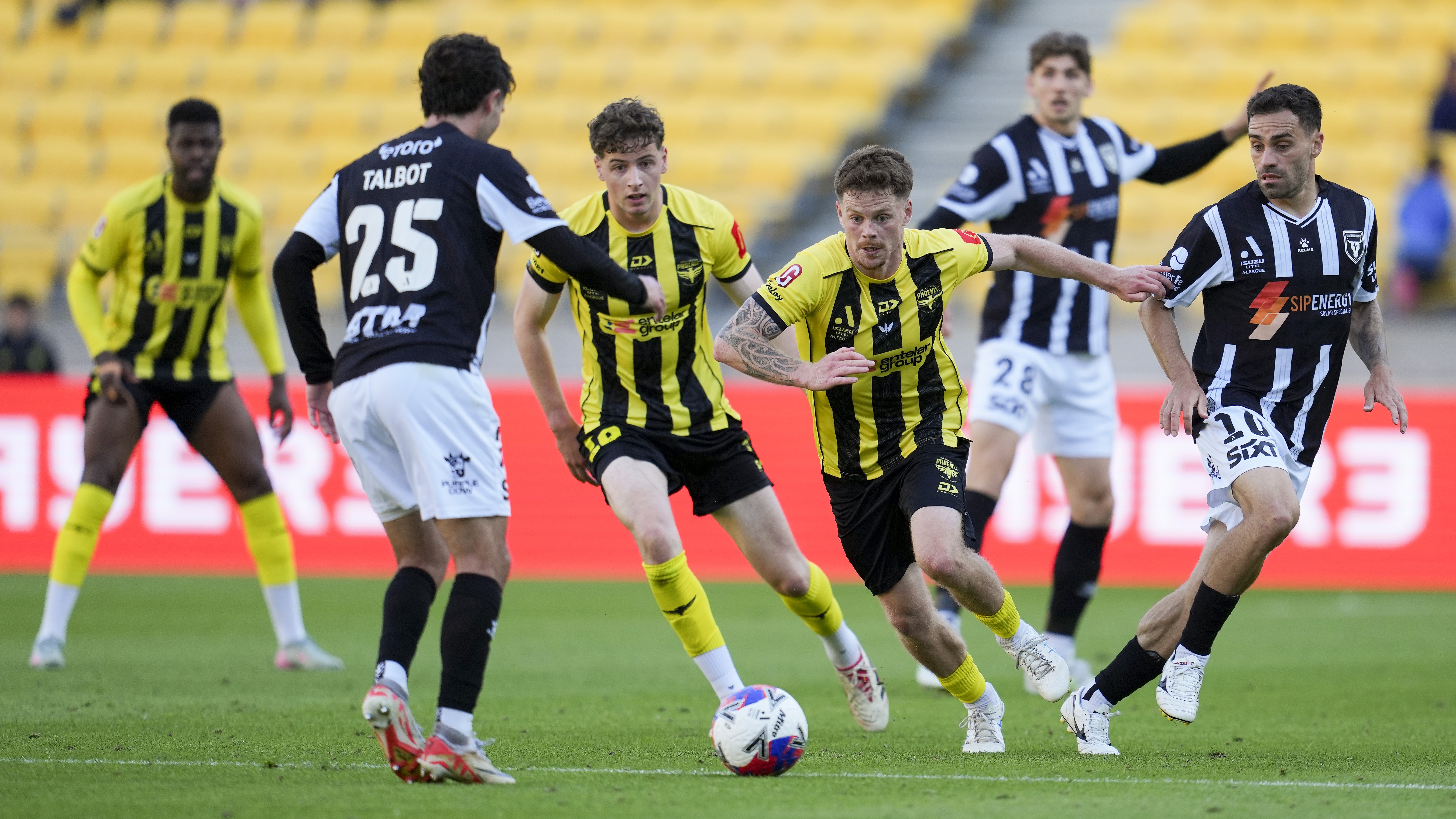 Fin Conchie of the Phoenix chases a loose ball during the round five A-League Men match between Wellington Phoenix and Macarthur FC at Sky Stadium, on November 22, 2025, in Wellington, New Zealand. (Photo by Hagen Hopkins/Getty Images)