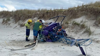Two escape 'rough landing' as helicopter comes down on beach 