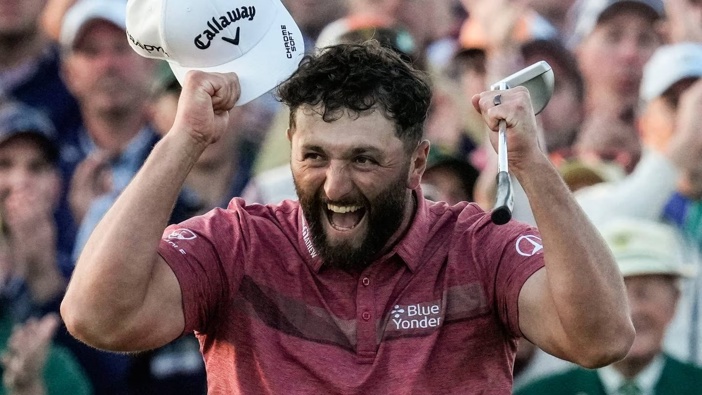 Jon Rahm, of Spain, celebrates on the 18th green after winning the Masters golf tournament at Augusta National Golf Club. Photo /AP