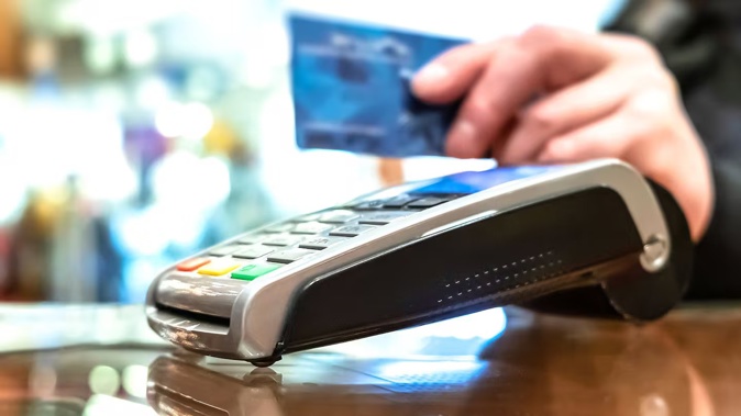 The cost of providing contactless payments will fall on merchants. Photo / Andrey Mikhaylov