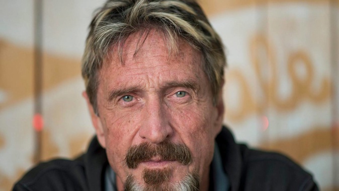 John McAfee shared a picture of a tattoo on his right bicep with the world in November 2019 with the message 'I was whackd. Check my right arm'. (Photo / Twitter)