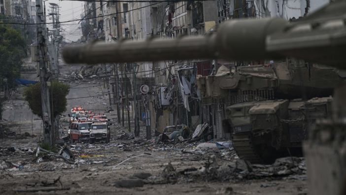 Ambulances are seen on a road near an Israeli forces tank during an Israeli army ground operation in the Gaza Strip, Wednesday, Nov. 22, 2023. Photo / AP