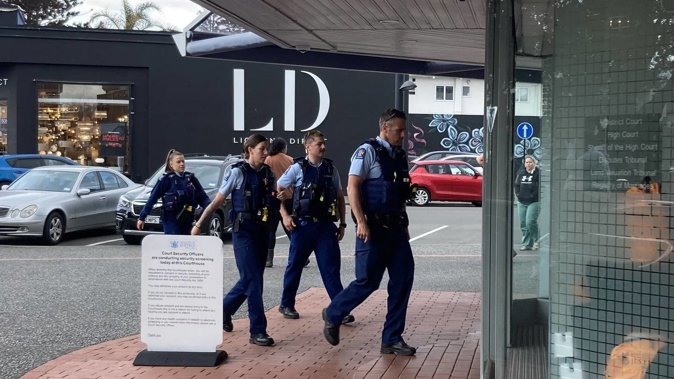Police arrive to restore order at the Napier courthouse. Photo / Ric Stevens