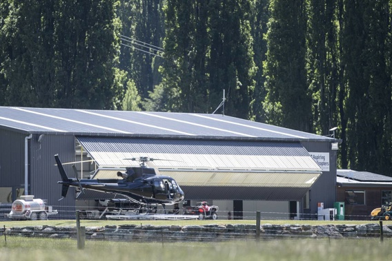 A black unmarked helicopter linked to the filming at Aspiring Helicopters hangar. Photo / George Heard