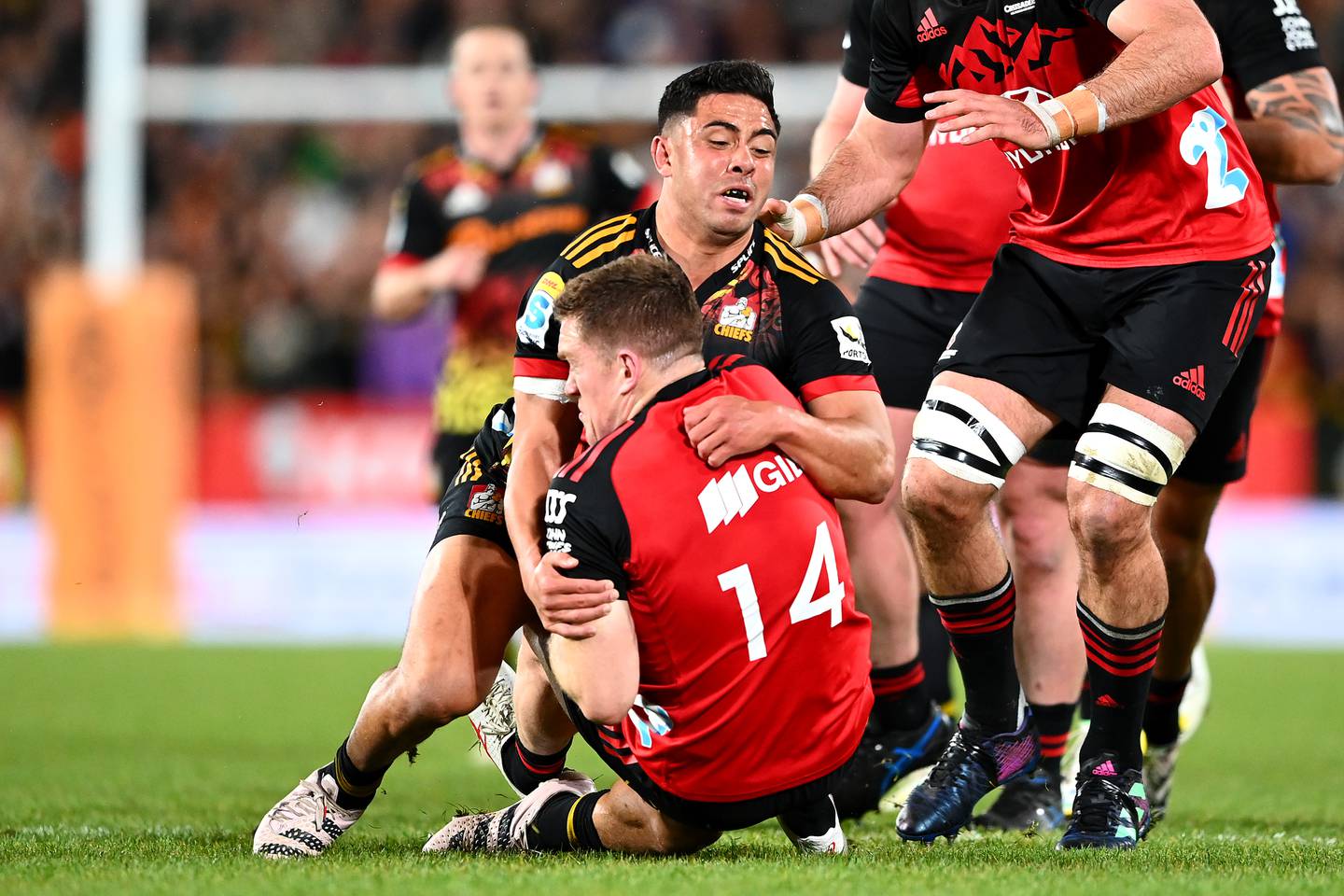 Anton Lienert-Brown of the Chiefs tackles Dallas McLeod of the Crusaders during the Super Rugby Pacific Final match between Chiefs and Crusaders at FMG Stadium Waikato on June 24. Photo / Hannah Peters / Getty Images