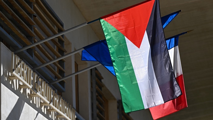 The Palestinian flag is displayed on the Grabels' town hall, near Montpellier, southern France, next to European and French flags. Photo / Gabriel Bouys, AFP