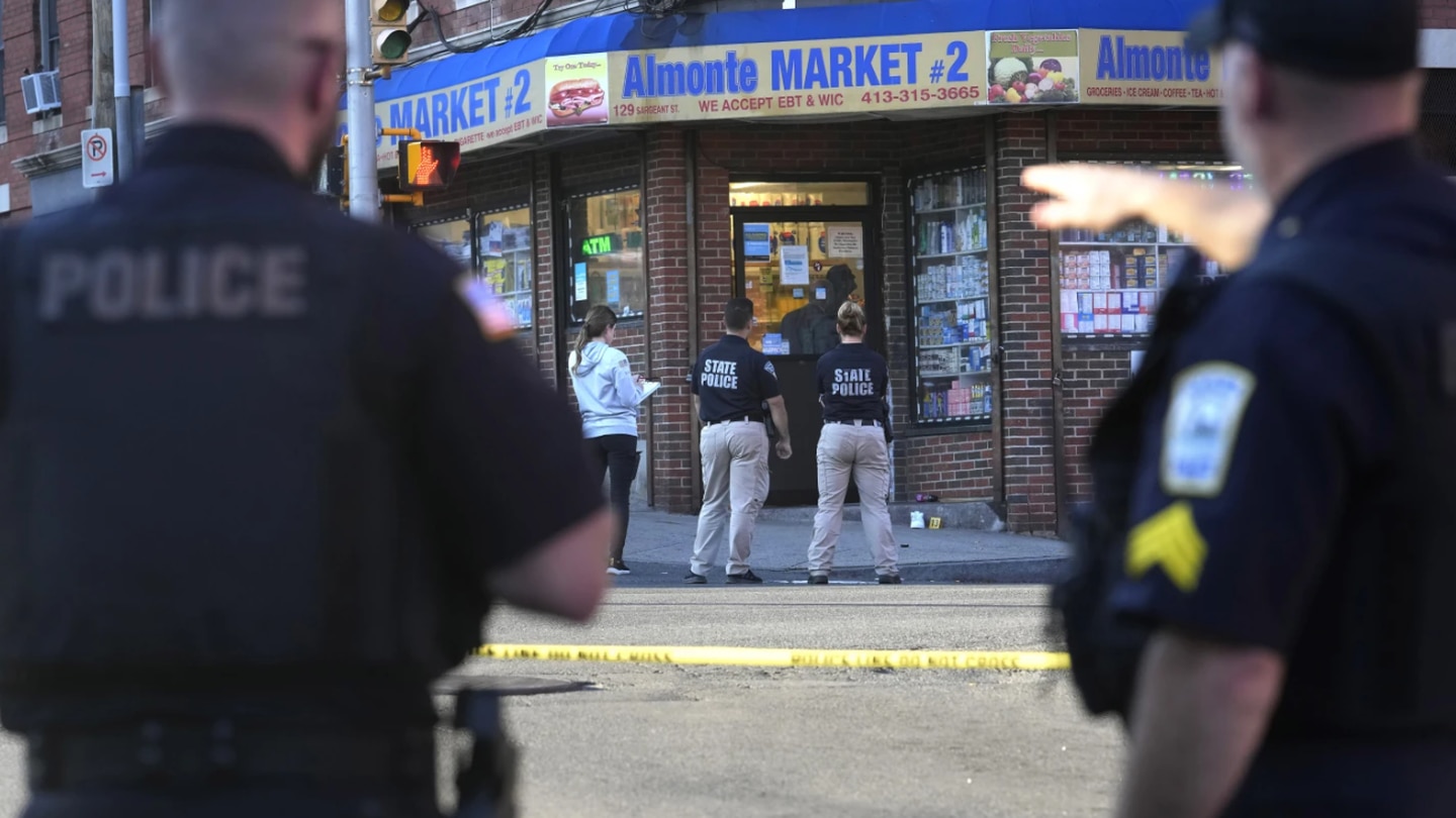Law enforcement officials investigate the scene where multiple were shot in Holyoke, Massachusetts. Police say at least three people were shot following a fight on a downtown street. Photo / AP