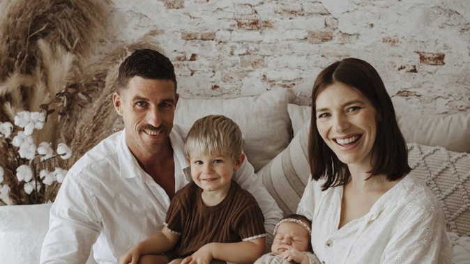Elysha Ludlow said her husband Rob, pictured with their two children, is determined to recover from the street attack that nearly claimed his life.