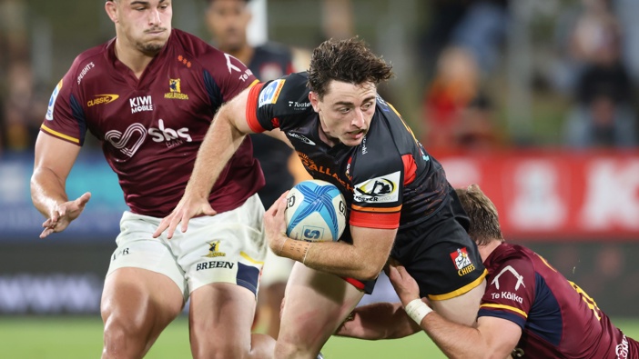 Josh Jacomb of the Chiefs is tackled during the round 10 Super Rugby Pacific match between Chiefs and Highlanders at FMG Stadium, on April 19, 2025, in Hamilton, New Zealand. (Photo by Michael Bradley/Getty Images)